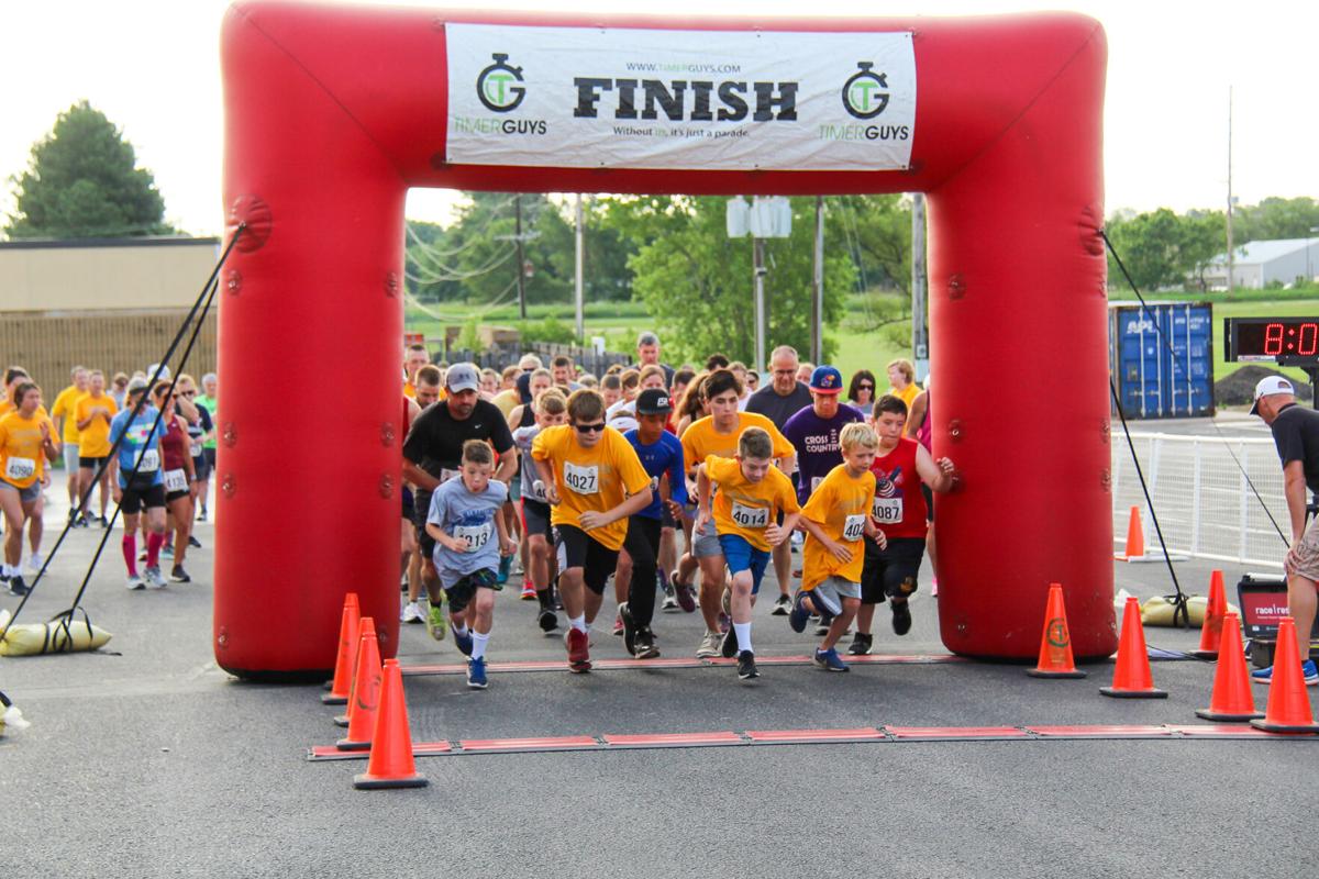 Runners take of at the starting line at the new WHS location.