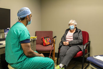 Dr. Reddy consults with a patient at the Winfield Healthcare Center.