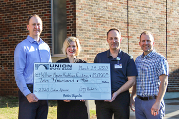 Union State Bank presents a check for the renewal of its annual gala sponsorship benefiting the William Newton Healthcare Foundation. From left: Union State Bank Winfield Market President Cory Helmer, William Newton Healthcare Foundation Director Annika Morris, William Newton Hospital Chief Executive Officer Ben Quinton, and Union State Bank Loan Officer Rusty Zimmerman.