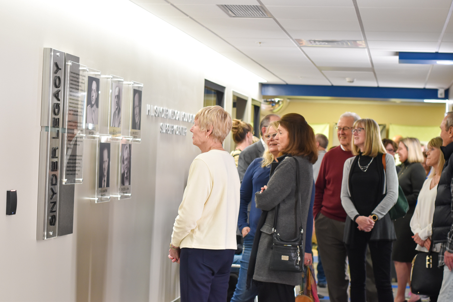 William Newton Hospital guests view the Snyder Legacy wall at the H. L. Snyder Medical Foundation Surgery Center.