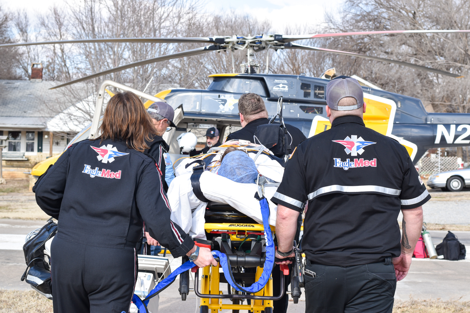The EagleMed crew heads toward the helipad during the dry run on January 9 at William Newton Hospital.
