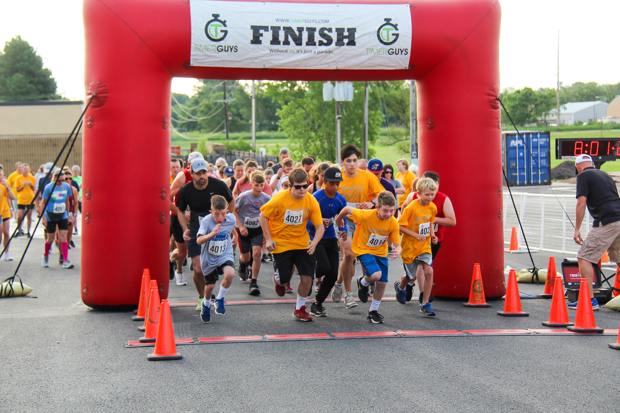 Participants for the 32nd Annual Junebug Jog take off from the starting line at Winfield High School for a 5k.