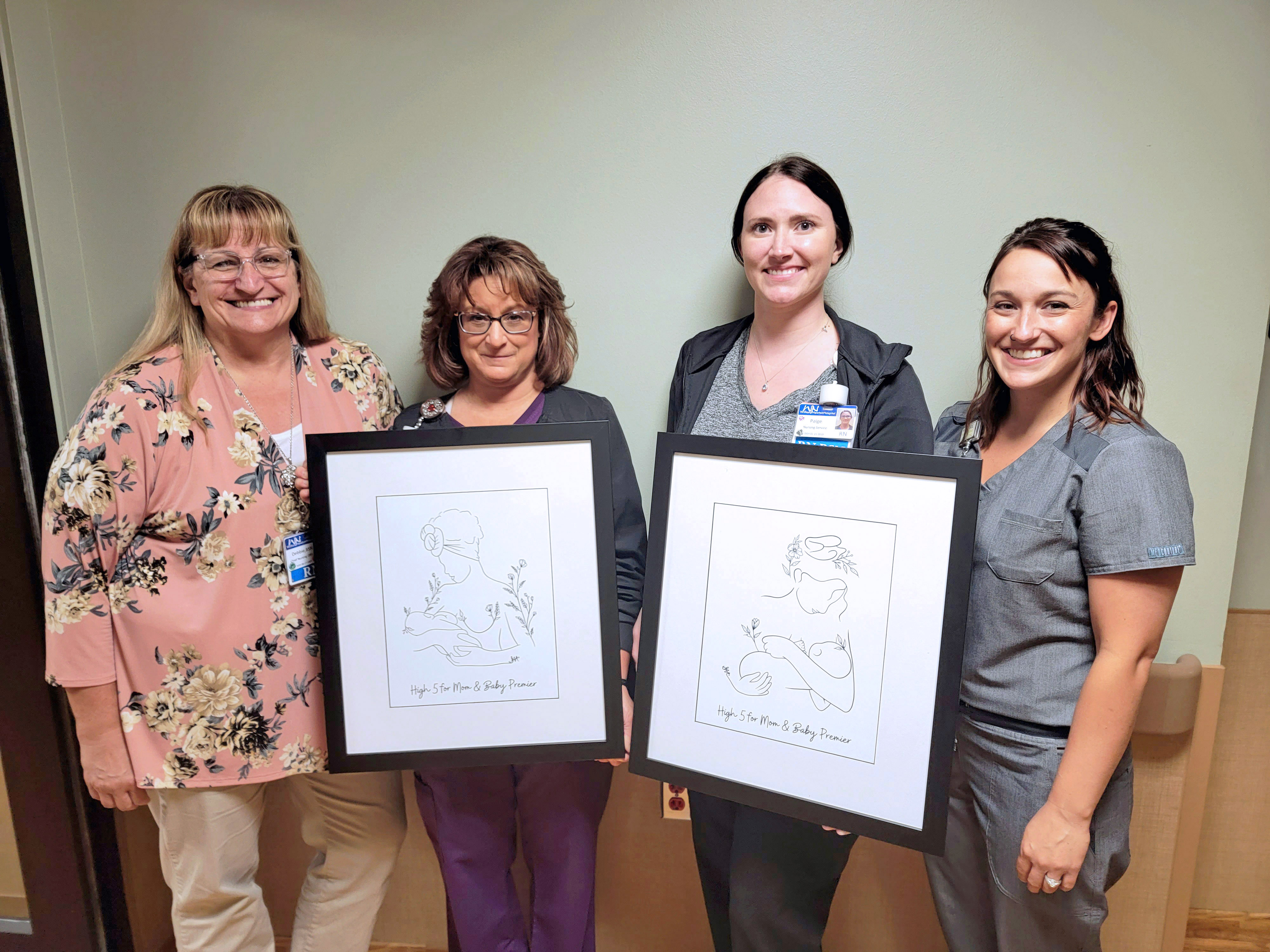 William Newton Hospital Family Birthing Center staff proudly display their High 5 for Mom & Baby art pieces. Pictured from left to right is Chief Nursing Officer Debbie Marrs, OB nurse Angie Brooks, OB nurse Paige Smith, and Family Birthing Center Manager Rachel Livingston.