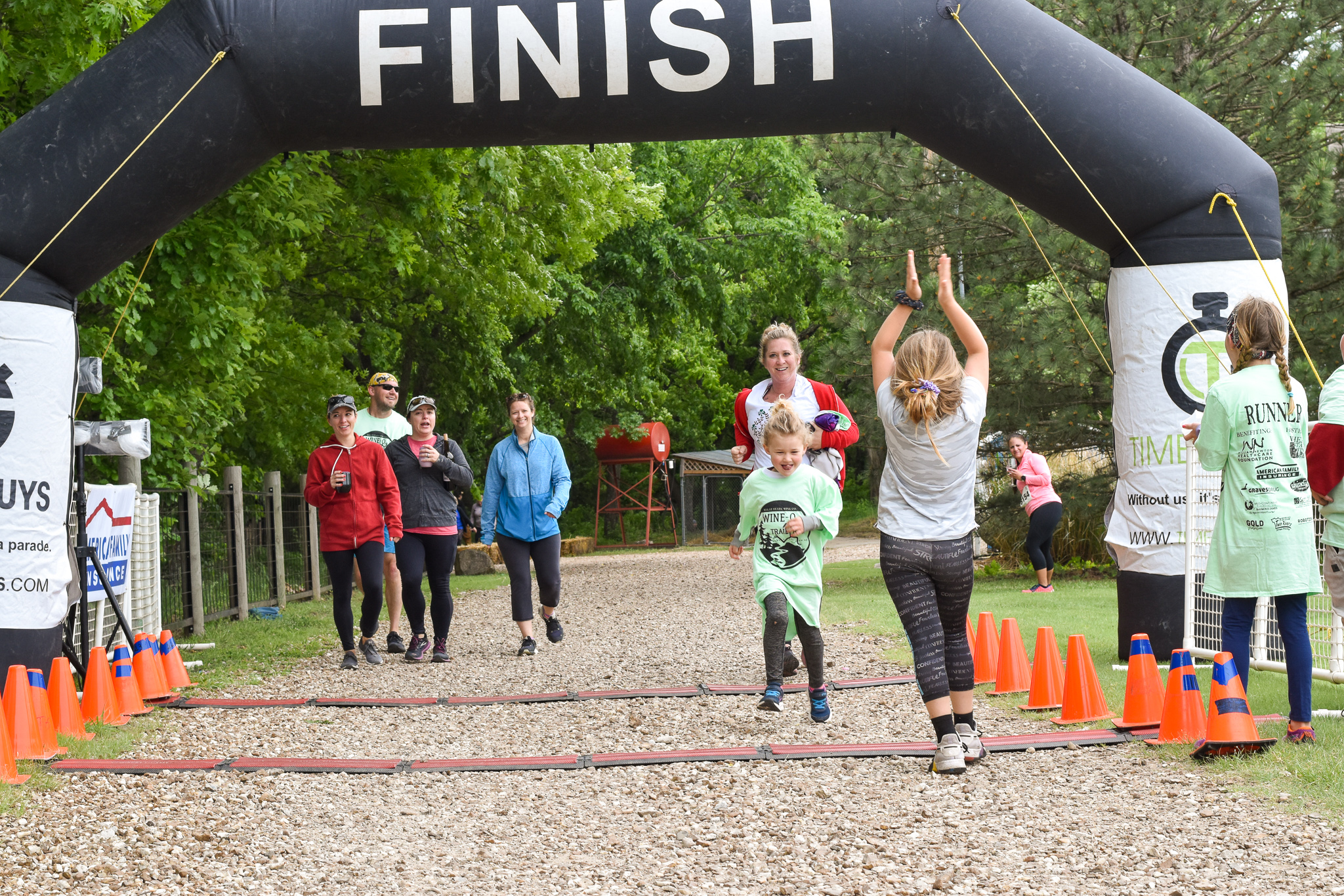 Walkers and runners make their way to the finish line at the 10th Annual Wine-O Trail Run.