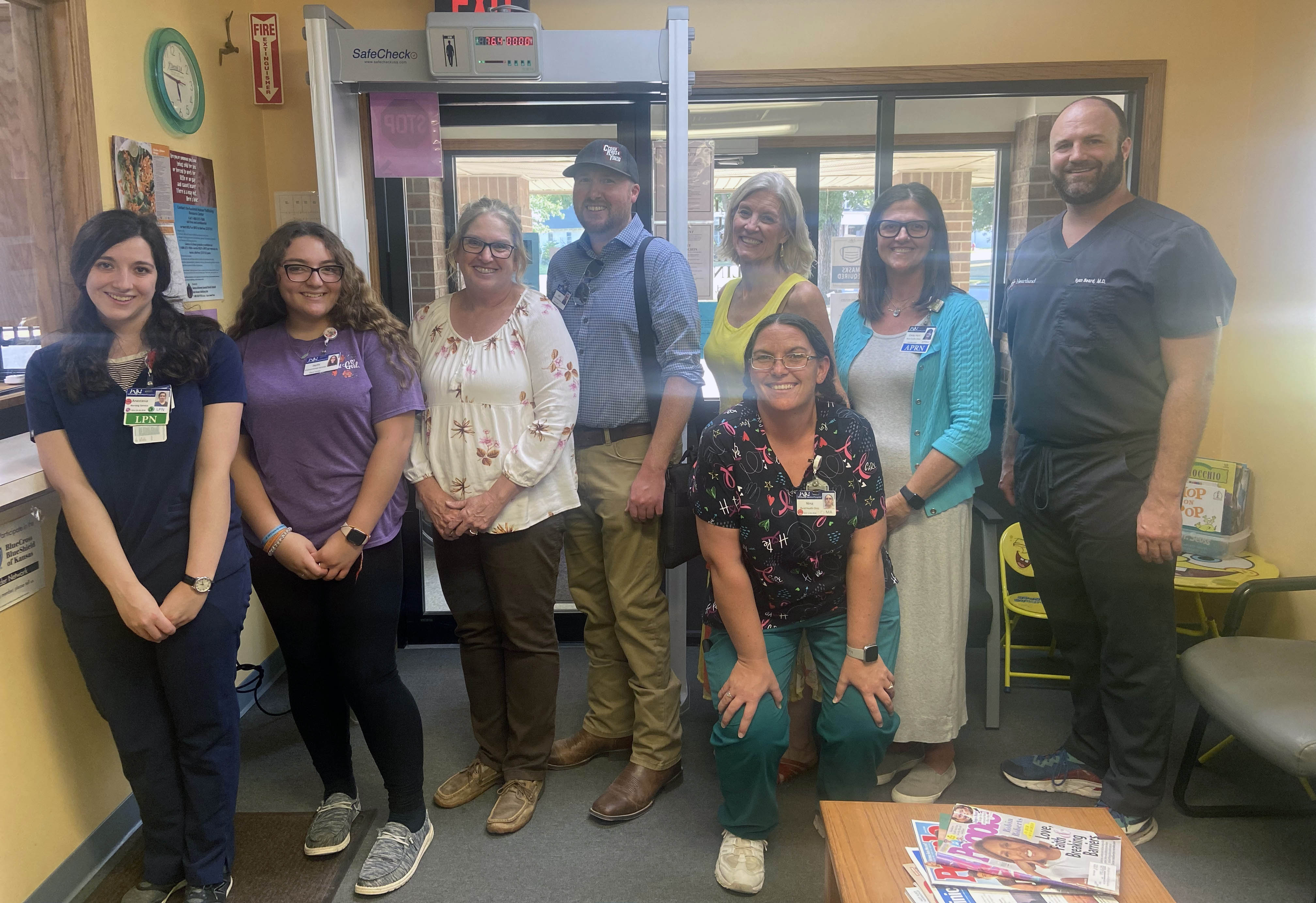 After the event at the Moline Public Library on August 4, William Newton Hospital providers and staff gather at the Moline Rural Health Clinic. From left: Tasia Konstantinidis, Jayda McDonald, Norma Hall, Josh Metzinger, Shirley Black, Nina McDonald (front), Carey Hurt, and Ryan Beard.