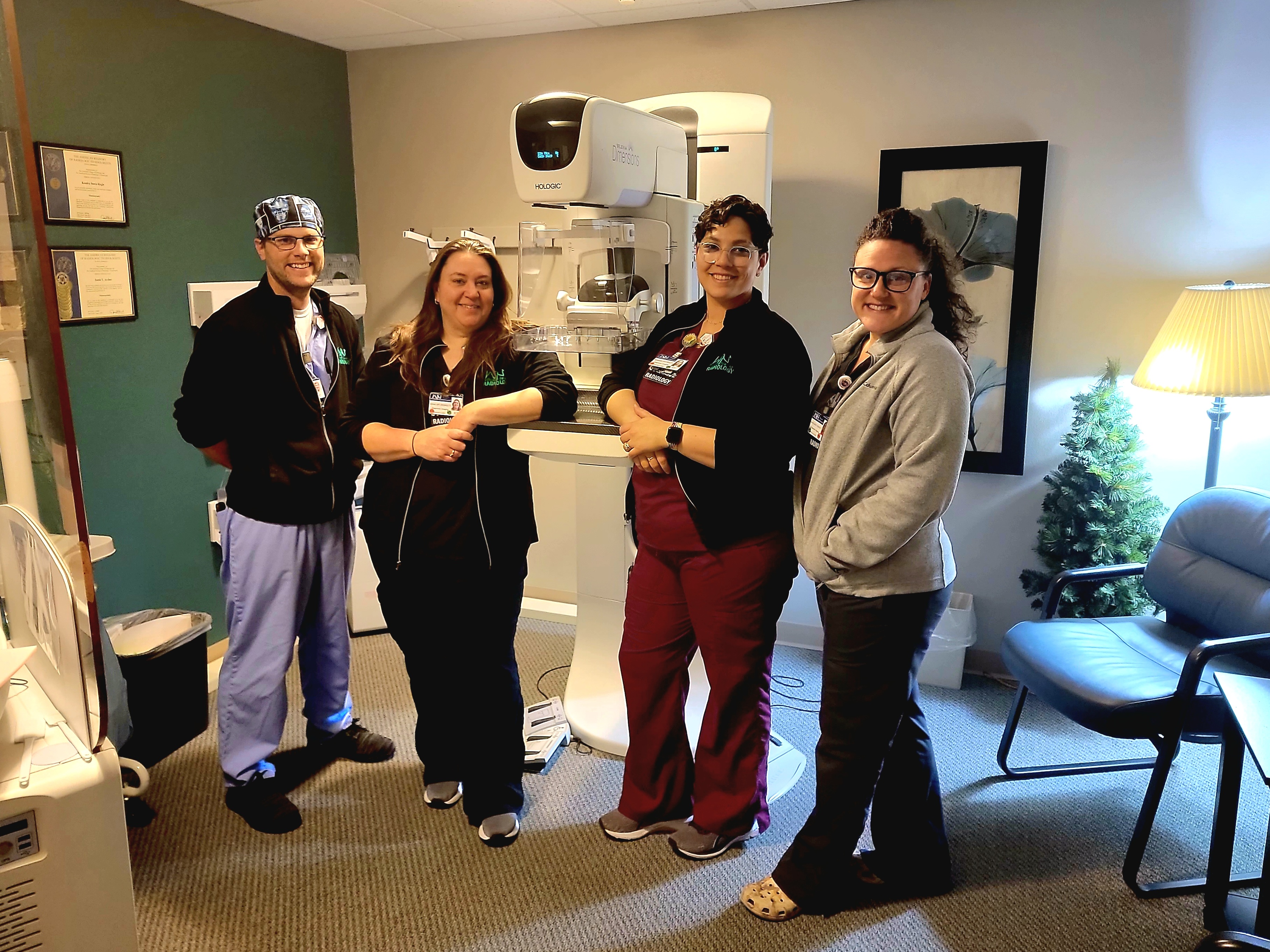 The women’s health team at William Newton Hospital’s diagnostic imaging department includes mammography technologists, breast sonographers, and breast MRI technologists. A few members of the team are shown with the mammography unit. From the left are Blake Boswell, Jamie Archer, Amanda Gropper, and Kendra Stanley.