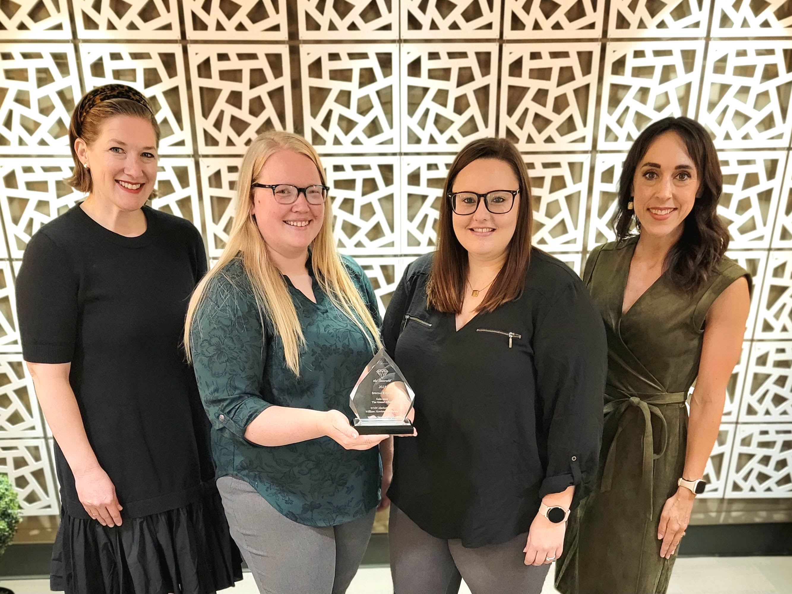 The 2022 William Newton Healthcare Foundation’s annual gala receives an award in the special events category. From left: Annika Morris, Kylie Stamper, Brittney Shaffer, and Sarah Johnson.