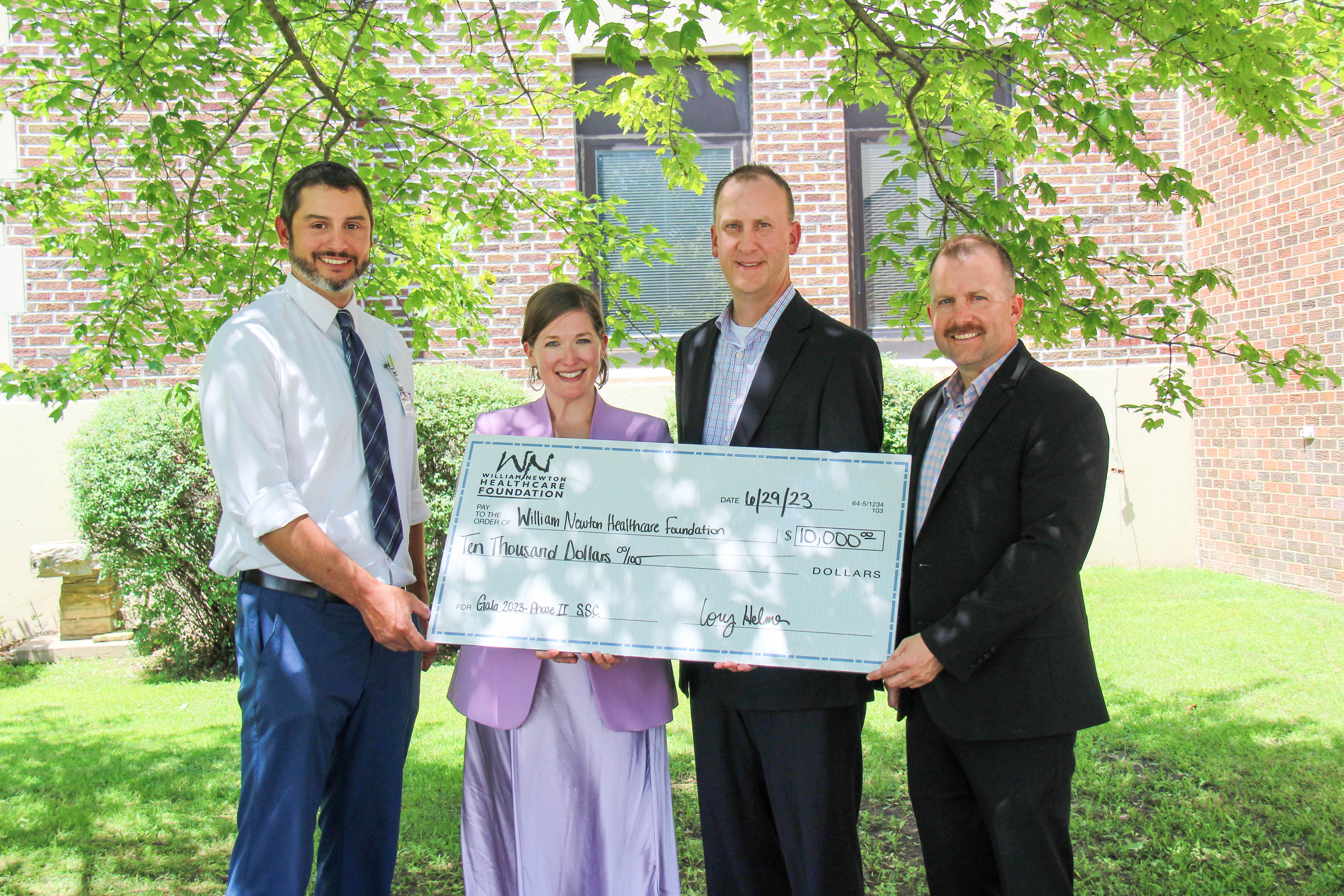 Union State Bank presents a check for the renewal of its annual sponsorship benefiting William Newton Healthcare Foundation. From left: William Newton Hospital Chief Executive Officer Brian Barta, William Newton Healthcare Foundation Executive Director Annika Morris, Union State Bank Winfield Market President Cory Helmer, and Union State Bank Vice President/Mortgage Lender Rusty Zimmerman.