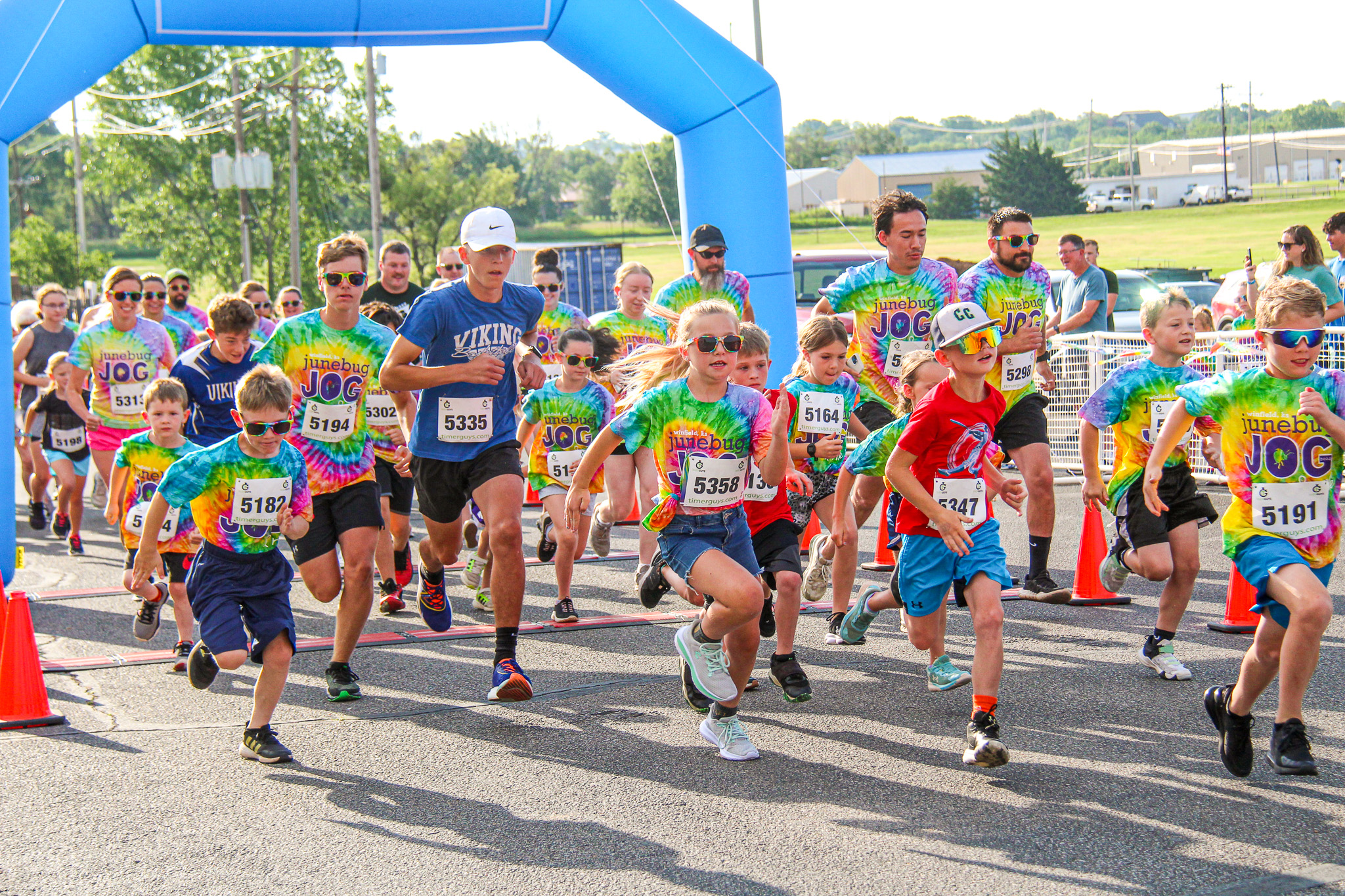 Participants take off from the starting line at the 2024 Junebug Jog at Winfield High School.