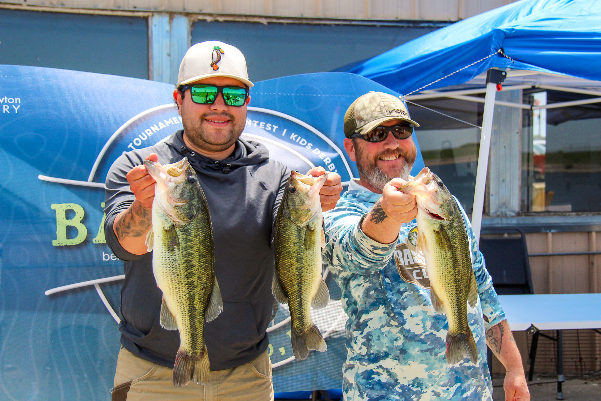Bass fishing tournament winners Jahsiel Calzada and Jake Dalzell show off their impressive catches at Bass N’ BBQ benefiting William Newton Hospital.