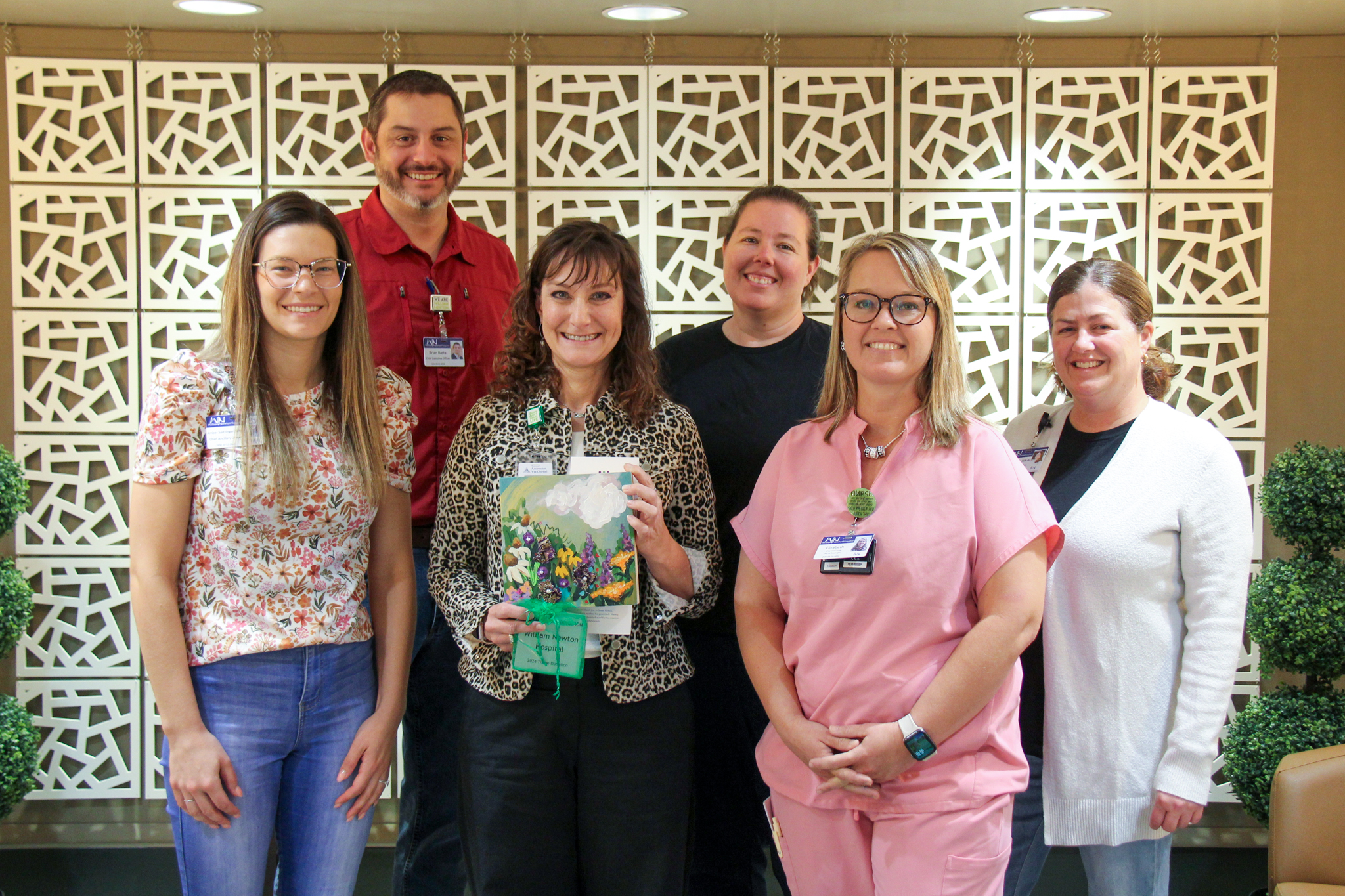 William Newton Hospital leaders are presented with the 2025 Excellence in Tissue Donation Award by Midwest Transplant Network. From left: Amber Seitzinger, WNH, Brian Barta, WNH, Angie Carr, MTN, Cassie Stein, WNH, Liz Henderson, WNH, and Laura Frazier, WNH.