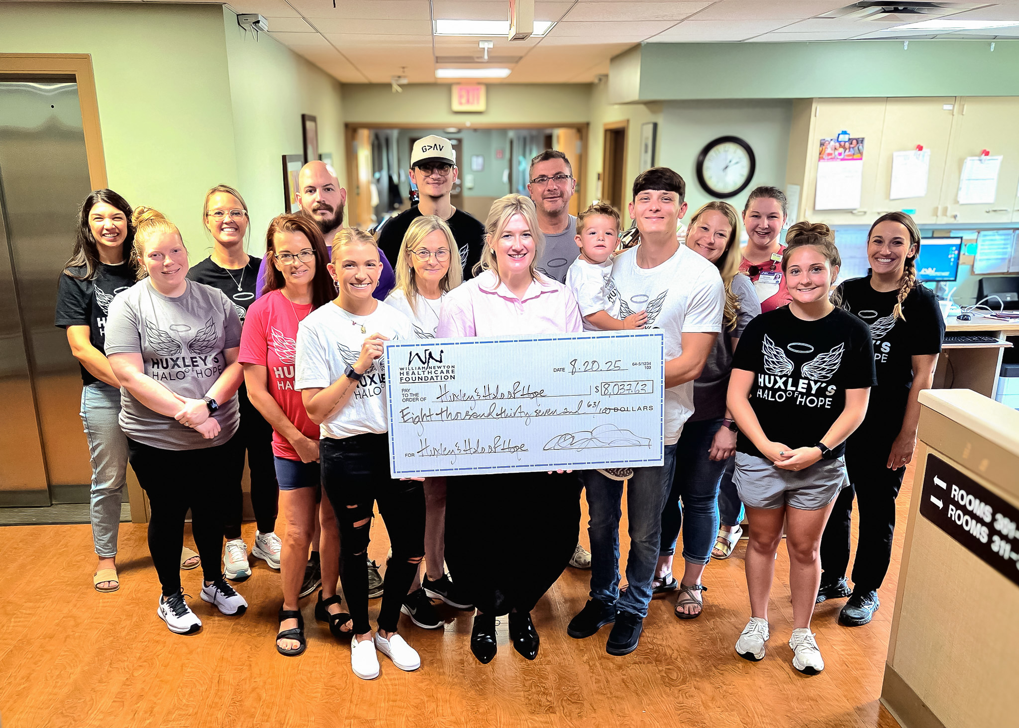 Family, friends, and hospital staff rally around the Smiths in the Family Birthing Center as Huxley’s Halo of Hope gets a kickstart from William Newton Hospital staff donations.